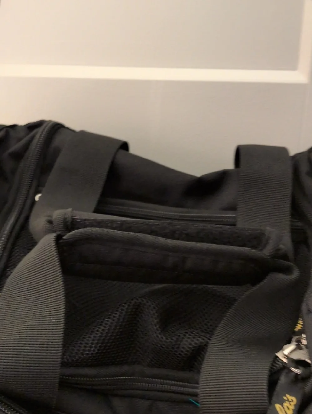 Cabela's Black Duffel Bag with Gold Logo and Adjustable Strap